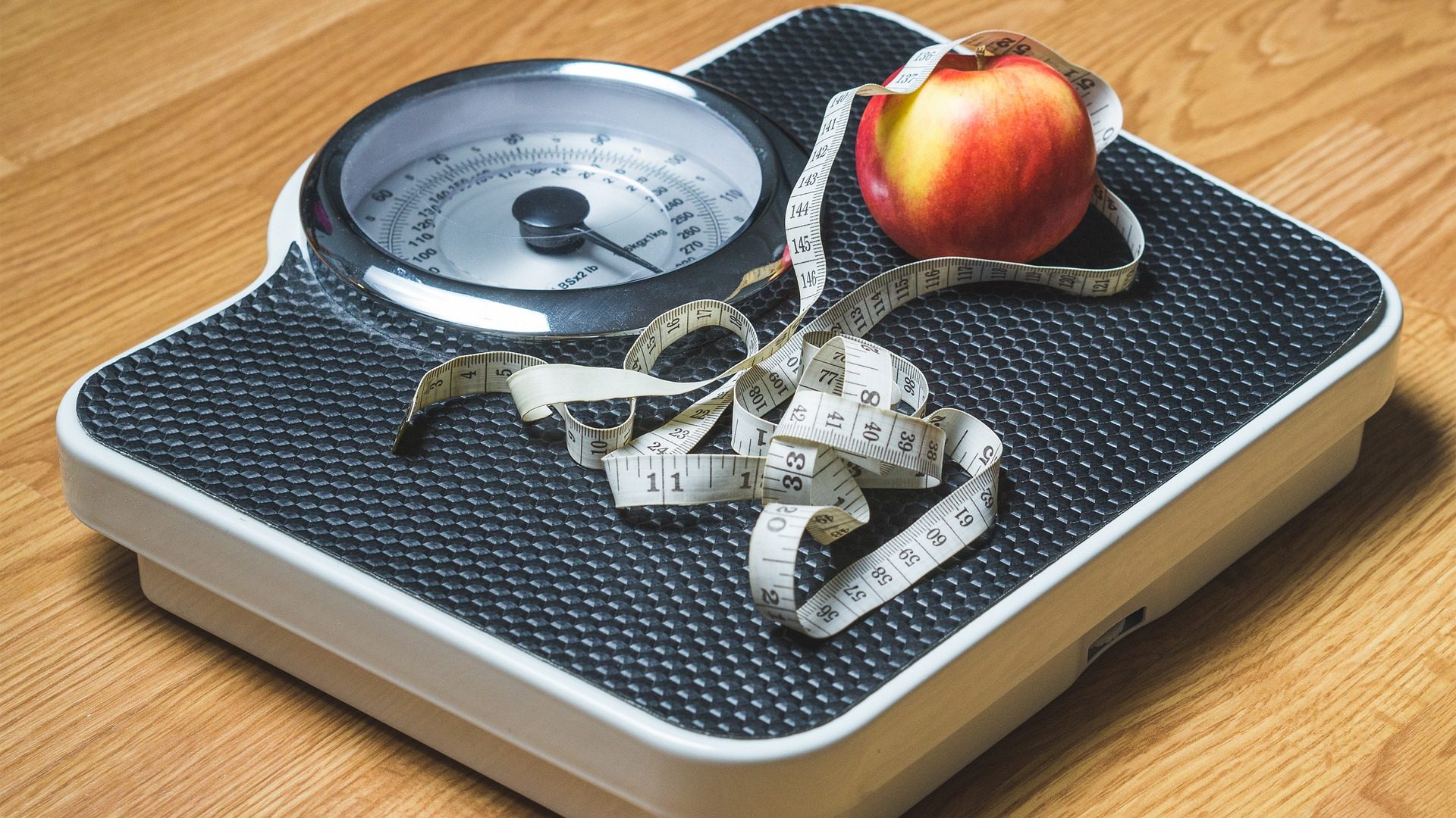Weight loss photo of scale and apple